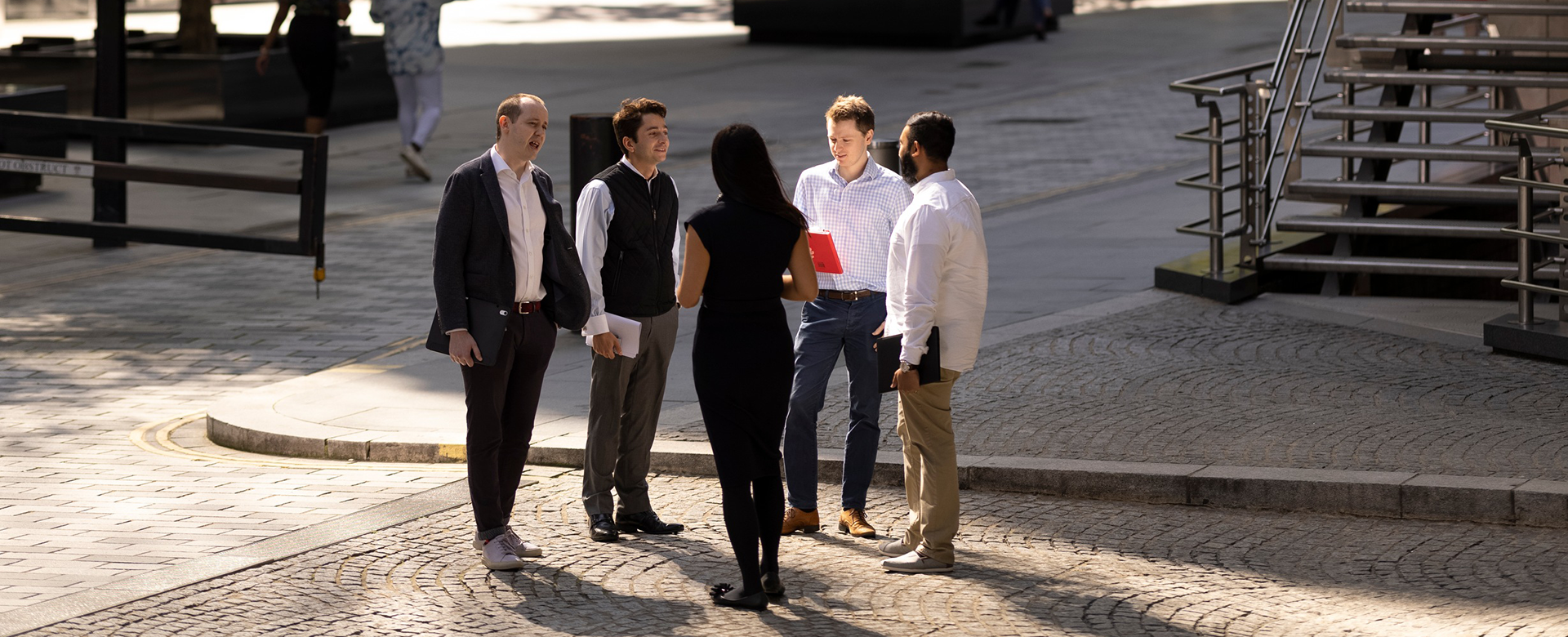 Lloyd's colleagues outside the Lloyd's building