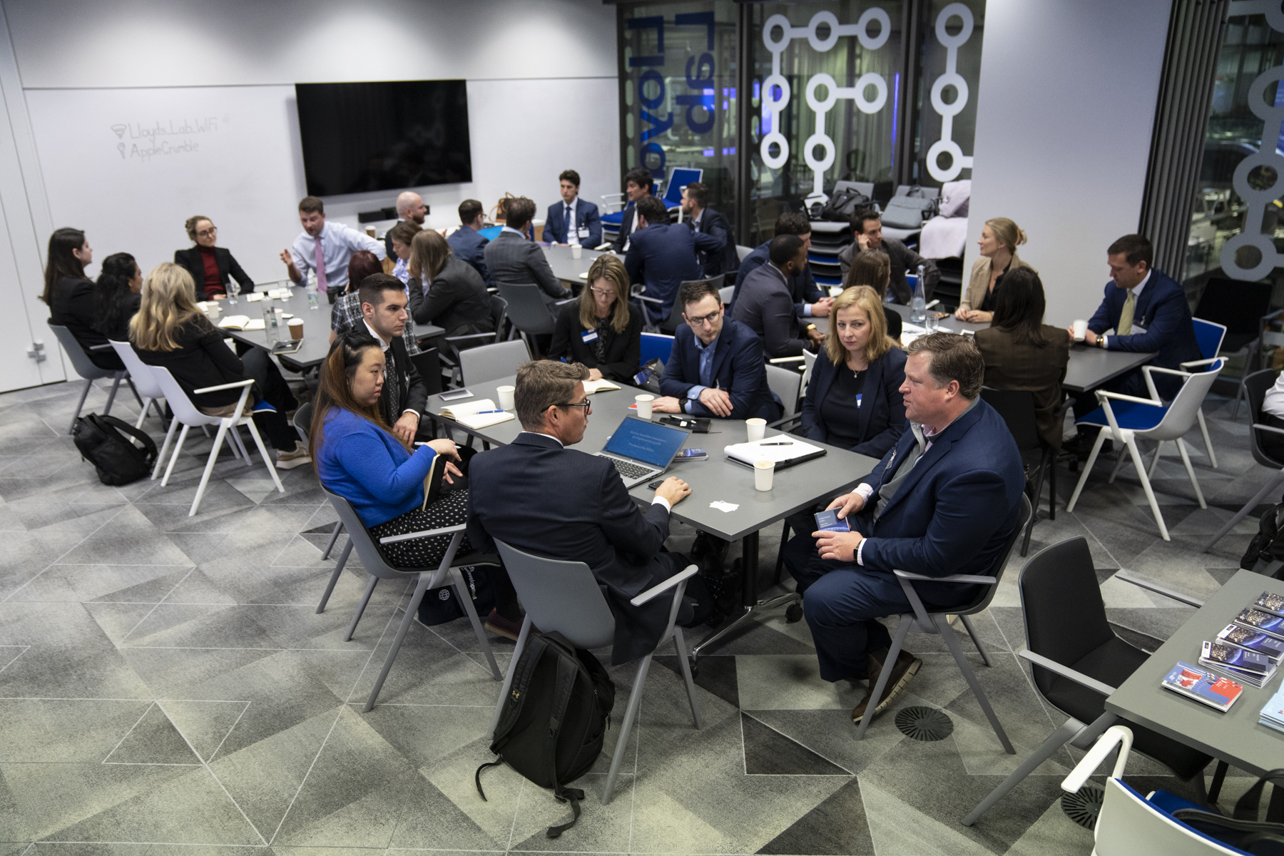 Delegates pictured sitting in the Lloyd's Lab talking 