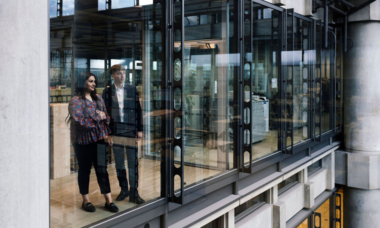 Colleagues inside the Lloyd's building