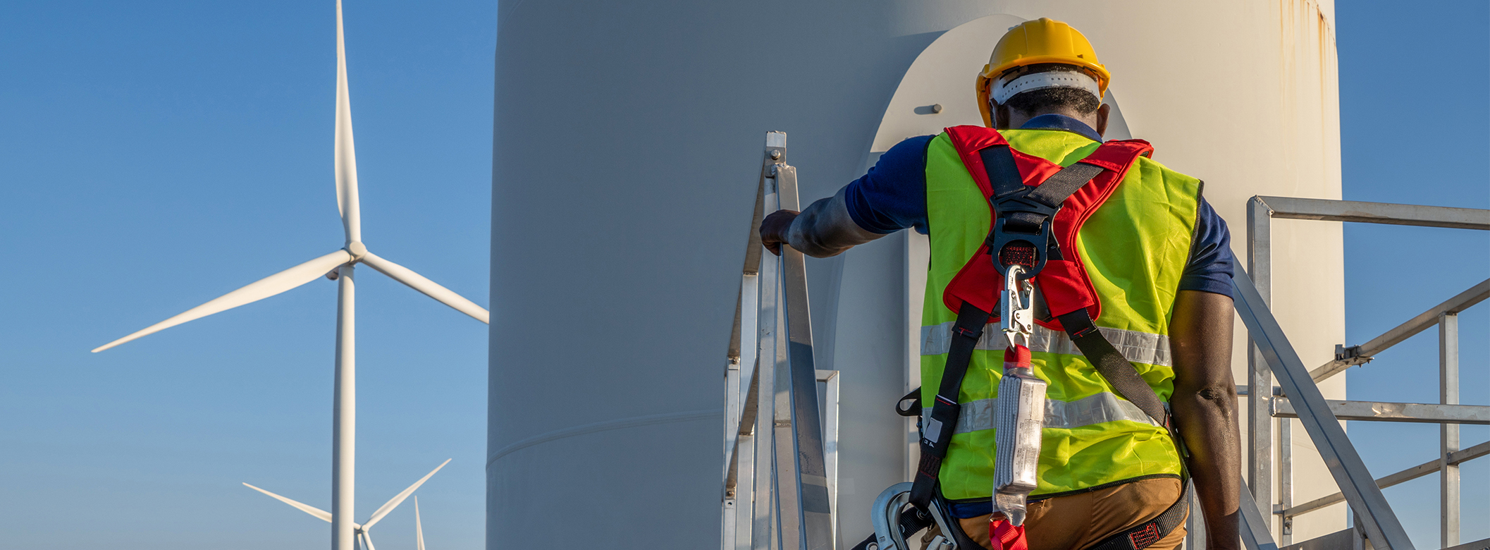 A construction worker on a wind turbine