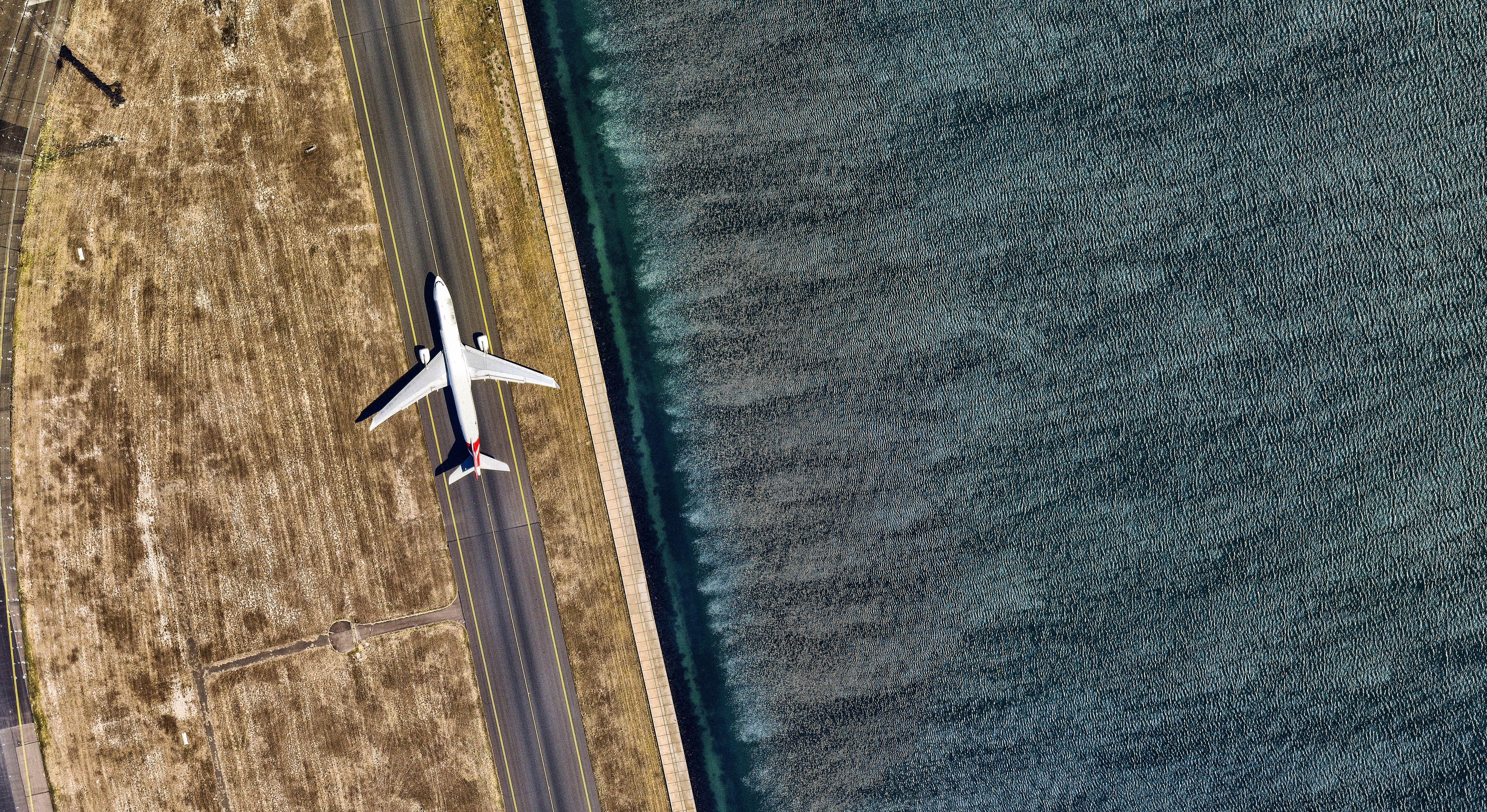An airplane on tarmac from above