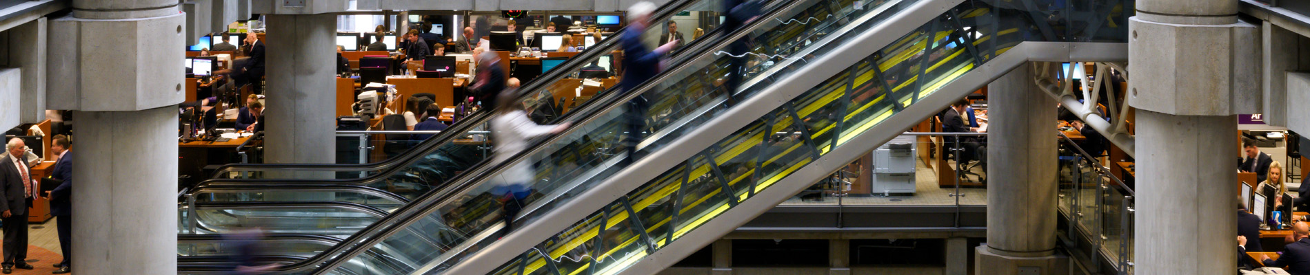 Banner image of escalators in underwriting room